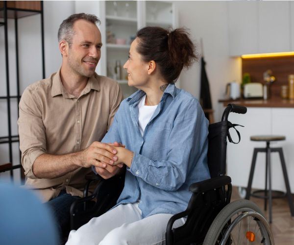 NDIS disability support worker assisting a client in Melbourne park